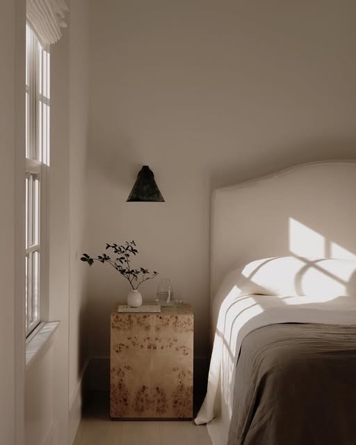 Soft afternoon light, natural stone and warm neutral textures, from the EN Interiors Instagram feed.